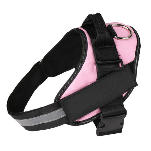 Pink dog harness with black straps and reflective material on a white background