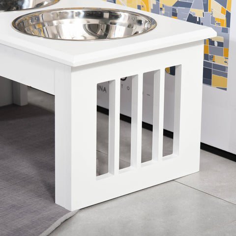 White elevated dog bowl stand with a metal bowl on a tiled floor.