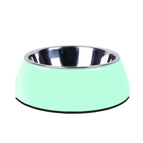 Green pet bowl with metallic interior on a white background