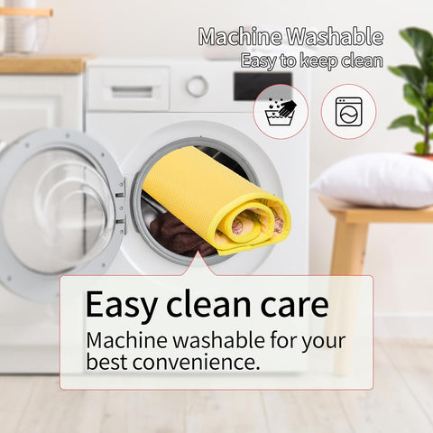 Yellow towel inside a washing machine with text about machine washability.