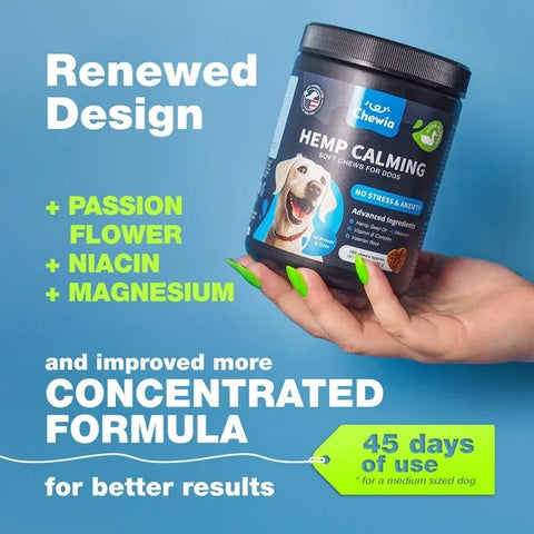 Hemp calming supplement for dogs with a hand holding the container against a blue background