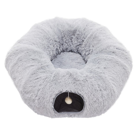 Fluffy gray pet bed with a small opening on a white background