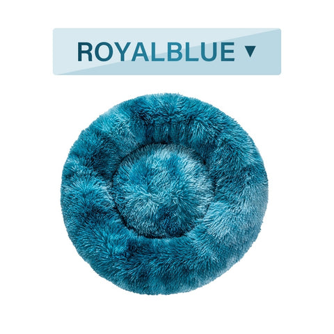 Fluffy blue pet bed with 'ROYALBLUE' label on a white background