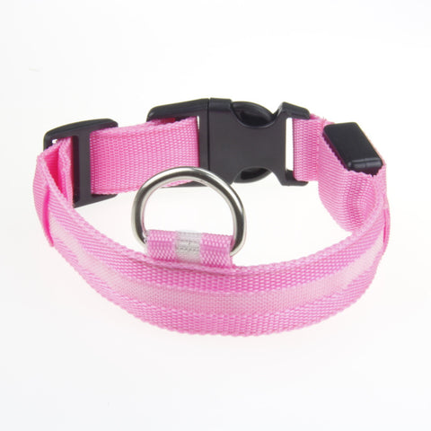 Pink adjustable LED dog collar with a light-up strip silver D-ring and black clasp on white background